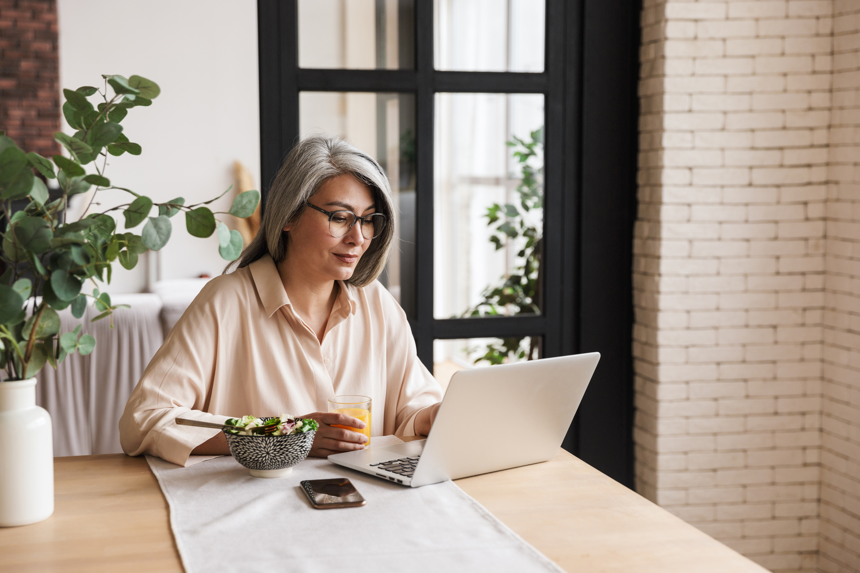 Concentrated Business Woman Using Laptop Computer